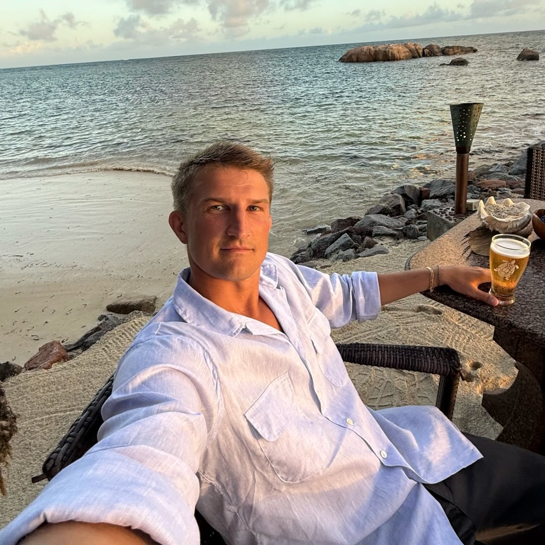 Jacob seated beside the ocean